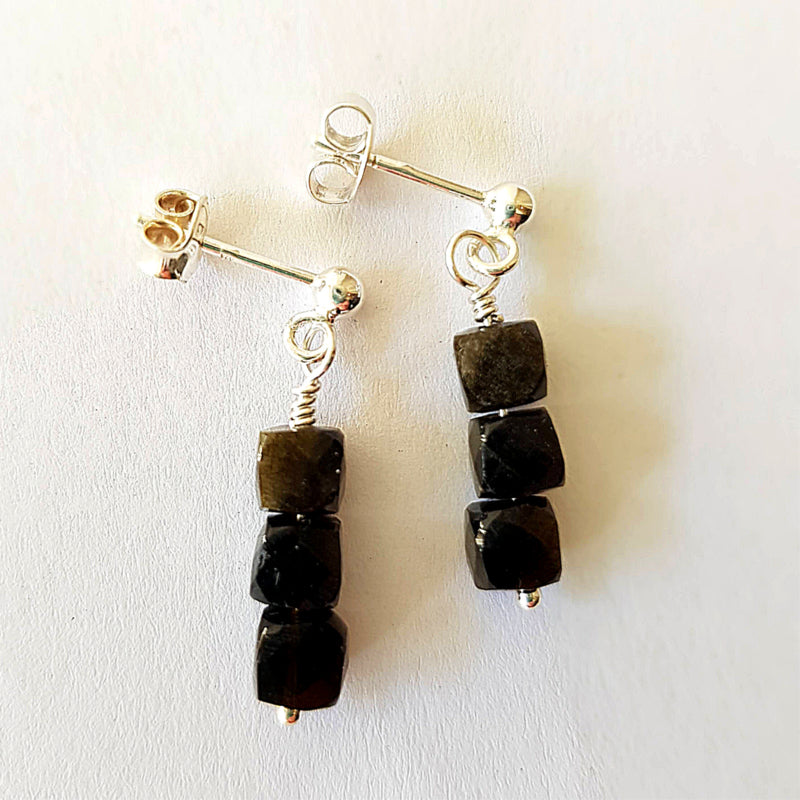 Oorstekers Insight, goud obsidiaan